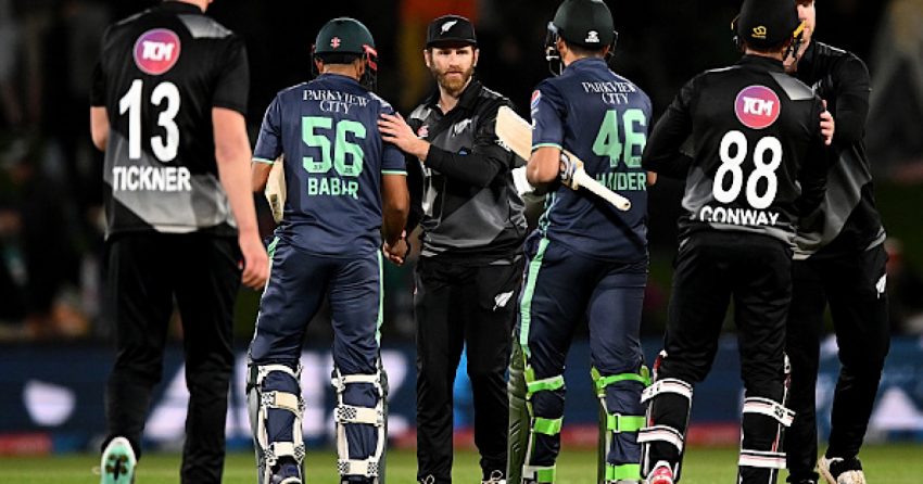 Pakistan and New Zealand cricket teams players shake hand after a cricket match