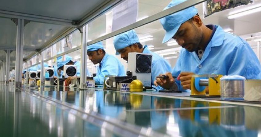 Workers working at a mobile phone manufacturing assembly